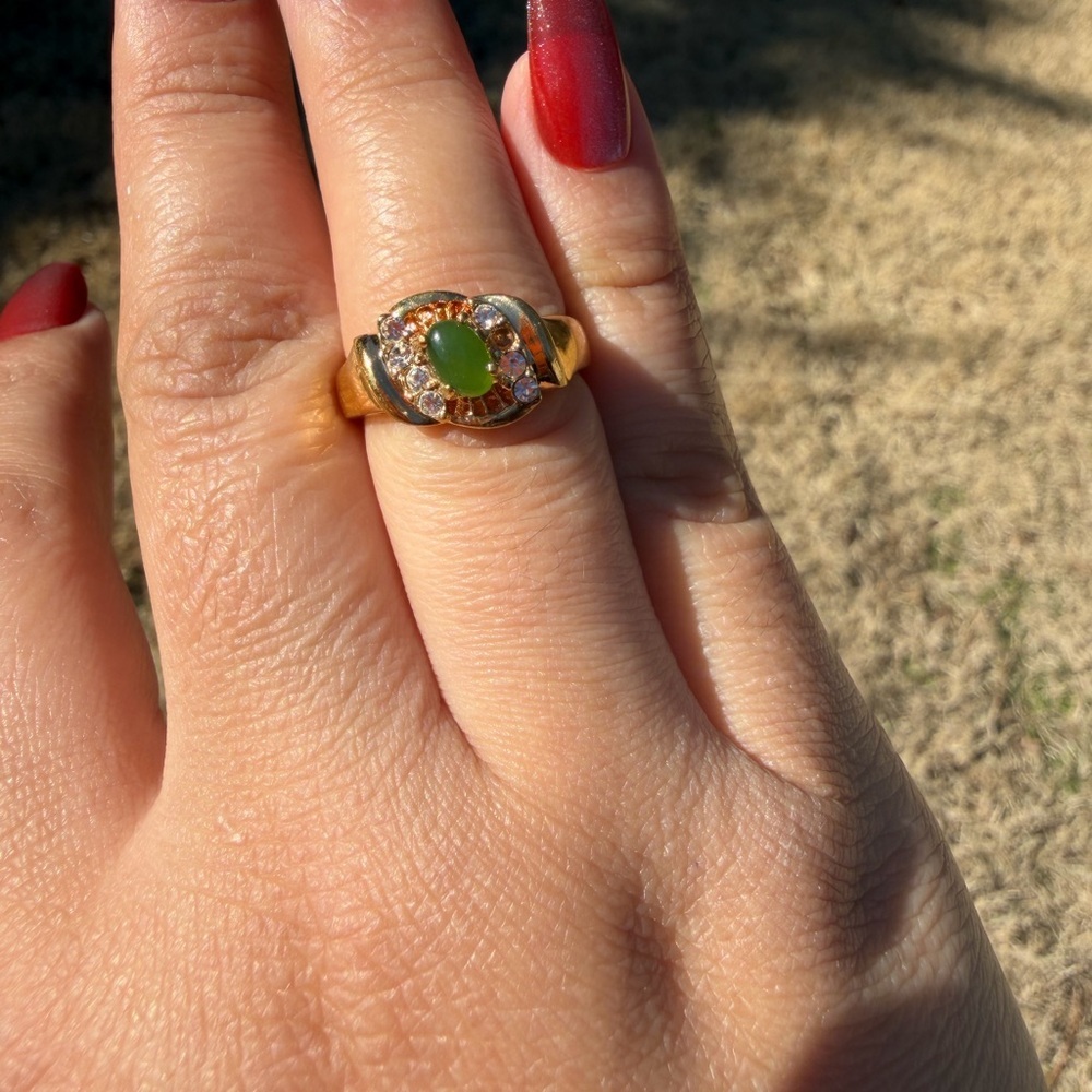 Gold Ring with Green Gemstone and Crystal Accents
